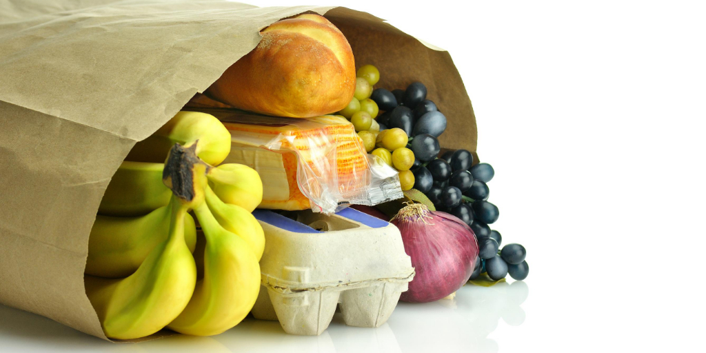 A grocery bag filled with groceries.